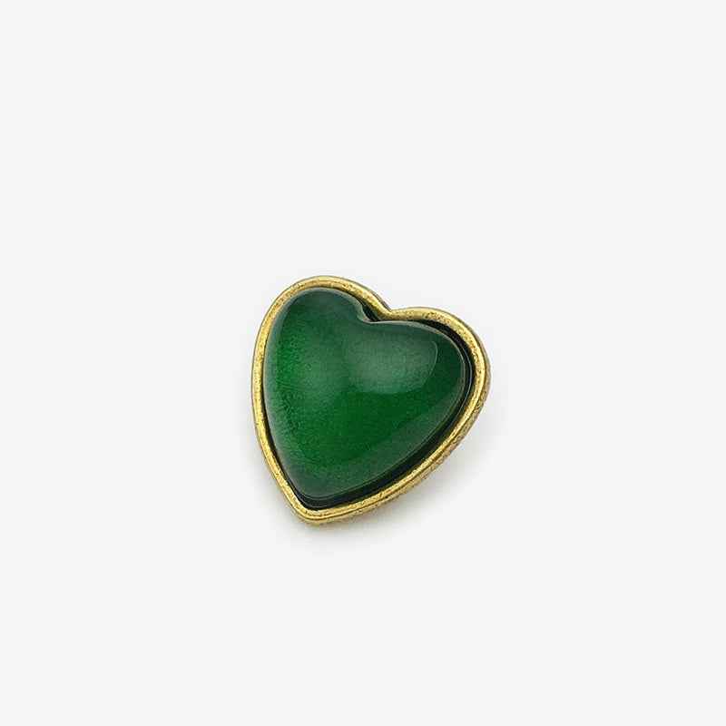 15mm heart buttons, red center with gold-tone border (front view)