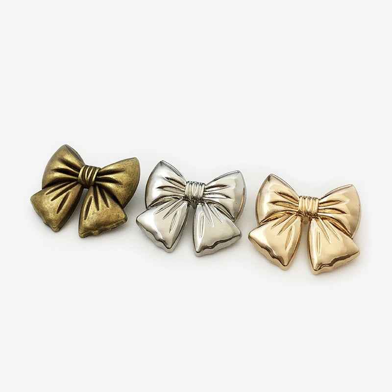 Schleifenknöpfe im 3er-Farbmix: gold, silber und bronze, 3D-Design