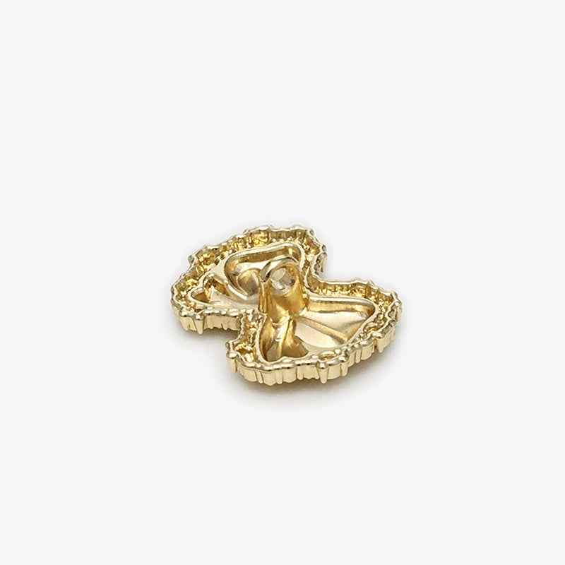 Gold bow metal shank button, back/underside with loop shank