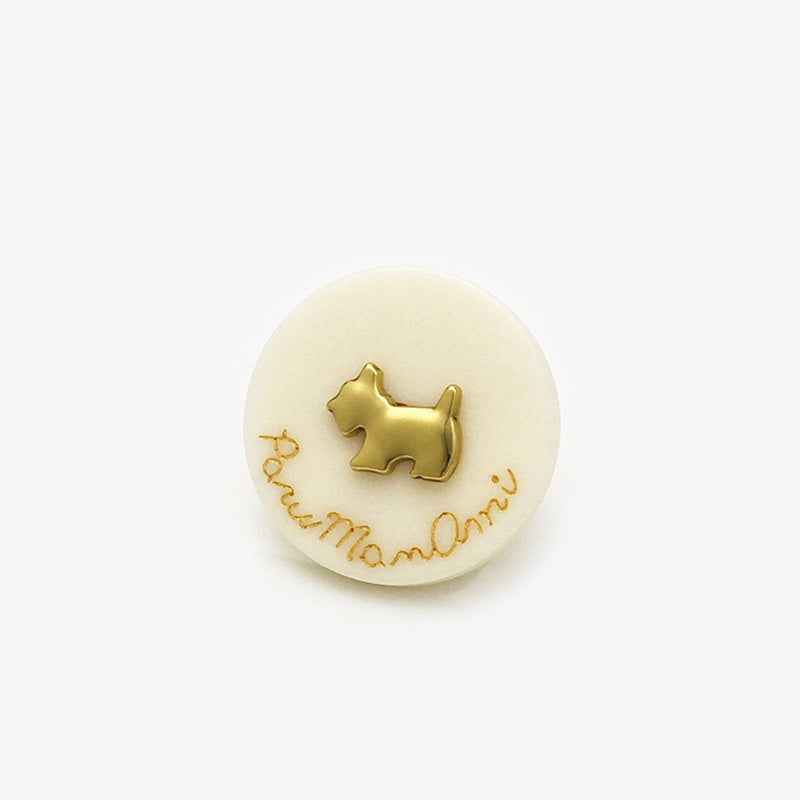Beige dog-themed resin shank button with gold puppy silhouette and paw-name text