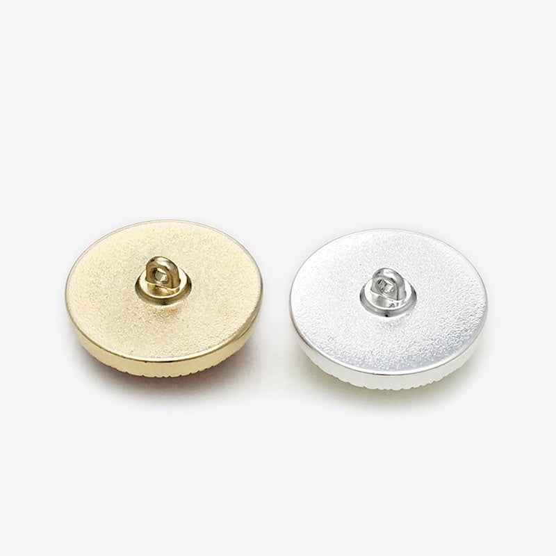 Back views of round shank buttons: gold-tone and silver-tone metal loop