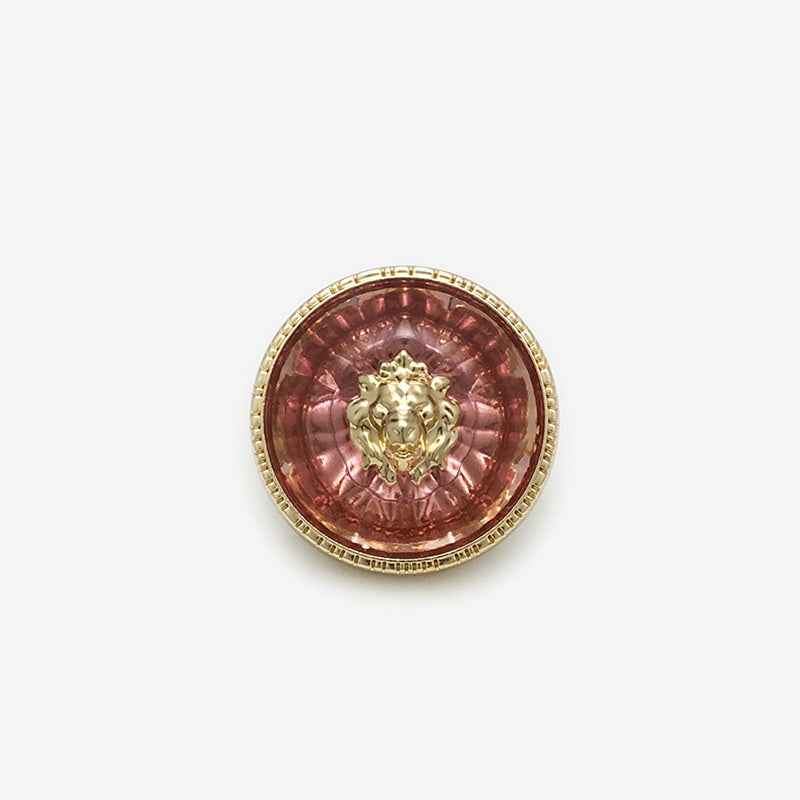 Red transparent resin lion-head round metal shank button, gold-tone rim