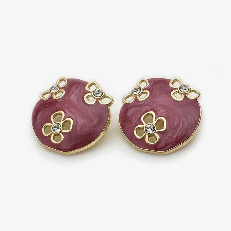 Oval floral enamel metal button, white with gold edges and rhinestone flower details