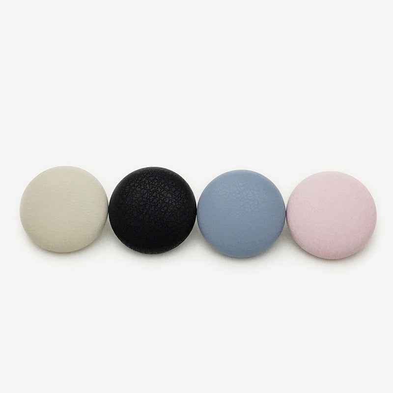 Mixed set of suede-effect metal shank buttons in beige, black, blue, and pink.