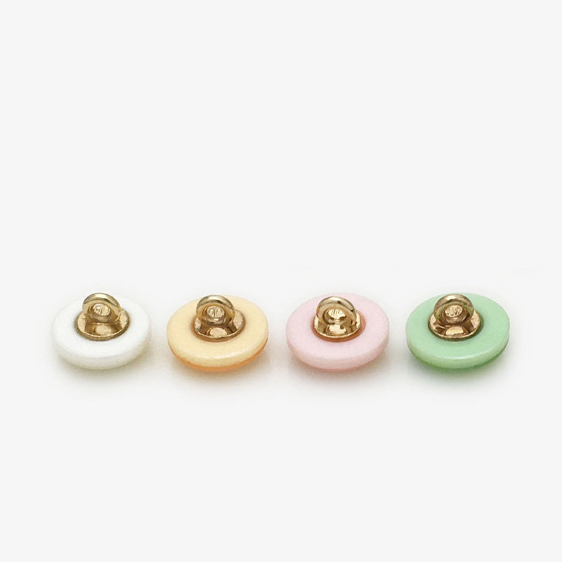 Back view of round 11mm resin buttons with gold shanks; mixed pearl-tones shown