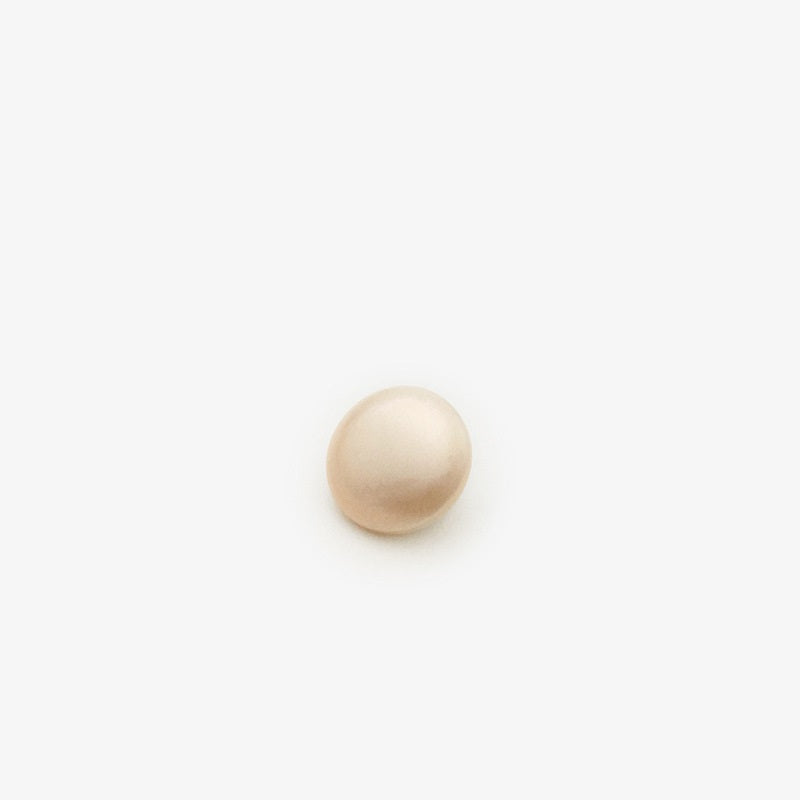 White pearl sew-on button with metal backing for coats, 1 pc close-up