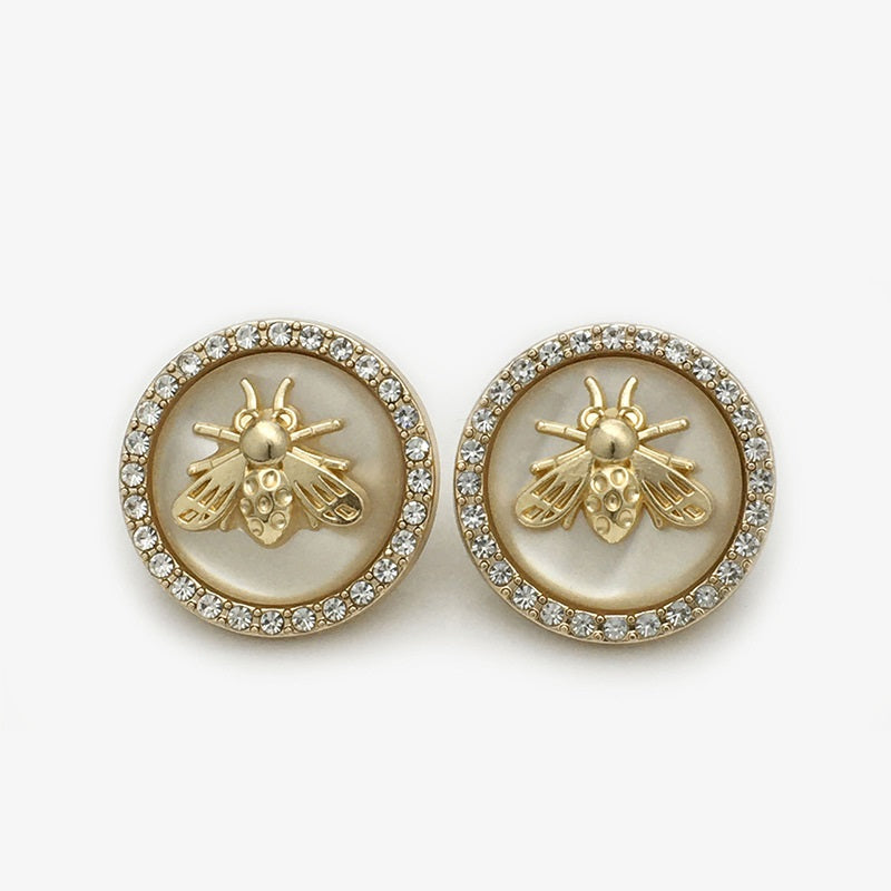 Bee coat button, beige two-tone resin, gold bee motif with rhinestone border
