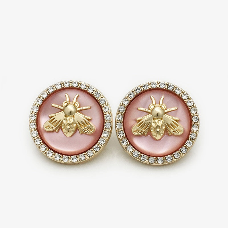 Bee coat button, Pink two-tone resin, gold bee motif with rhinestone border